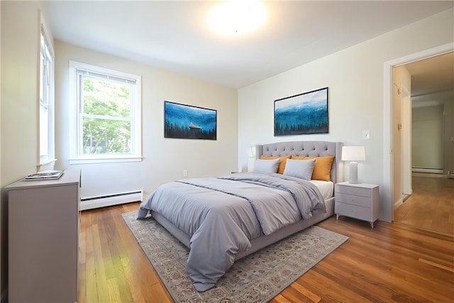 83 Vincent Ave, North Providence, RI 02904 - bedroom with baseboard heating and wood finished floors