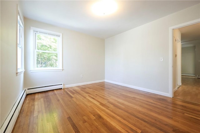 83 Vincent Ave, North Providence, RI 02904 - unfurnished room featuring baseboard heating, a baseboard radiator, and light wood-type flooring