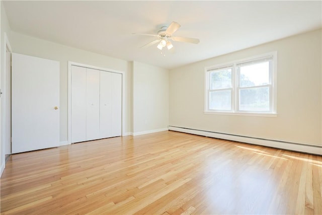 83 Vincent Ave, North Providence, RI 02904 - unfurnished bedroom featuring a baseboard heating unit, light wood finished floors, a closet, and a ceiling fan