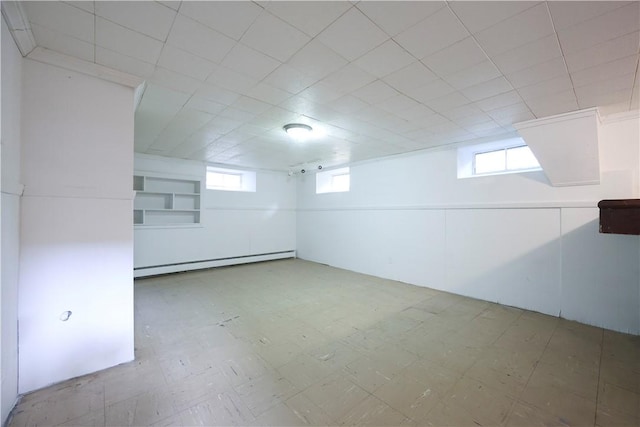 83 Vincent Ave, North Providence, RI 02904 - basement featuring a baseboard heating unit, tile patterned floors, and healthy amount of natural light