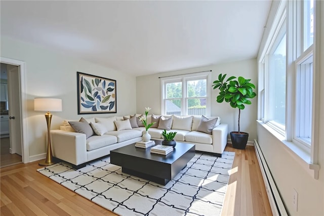 83 Vincent Ave, North Providence, RI 02904 - living room featuring a baseboard heating unit and light wood-style flooring
