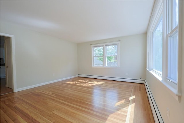 83 Vincent Ave, North Providence, RI 02904 - spare room featuring a baseboard heating unit and wood finished floors