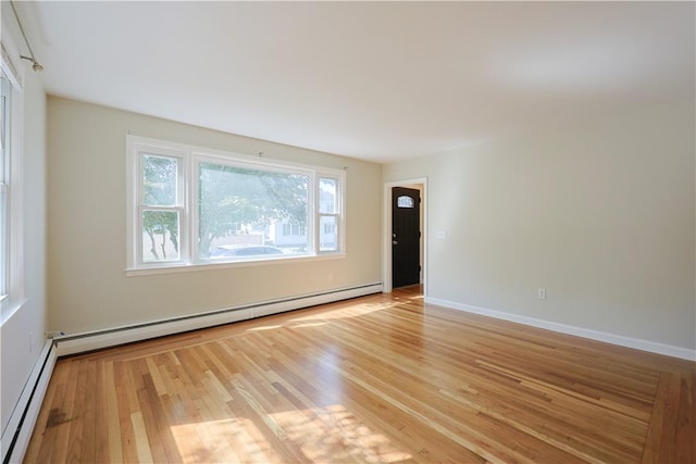 83 Vincent Ave, North Providence, RI 02904 - unfurnished room featuring baseboard heating and light wood finished floors