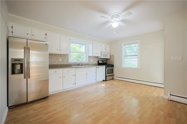 83 Vincent Ave, North Providence, RI 02904 - kitchen featuring stainless steel appliances, a baseboard heating unit, light wood-type flooring, ceiling fan, and backsplash