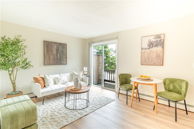 10 E St Unit 207, Cranston, RI 02920 - living room featuring a baseboard radiator and light wood-style flooring