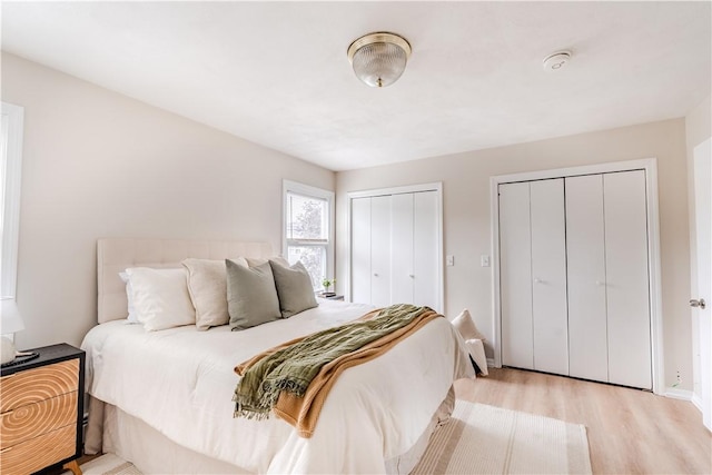 10 E St Unit 207, Cranston, RI 02920 - bedroom with multiple closets and wood finished floors