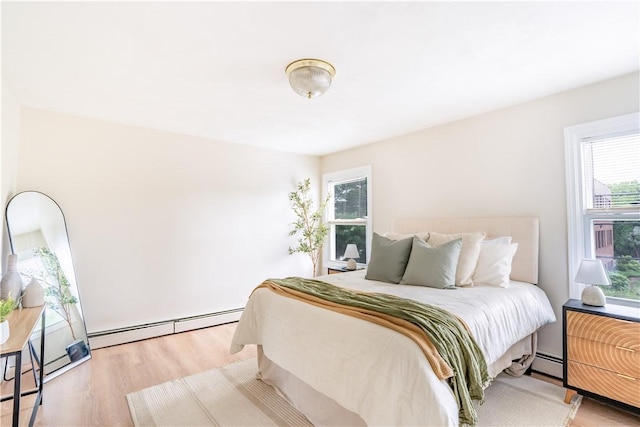 10 E St Unit 207, Cranston, RI 02920 - bedroom featuring baseboard heating and wood finished floors
