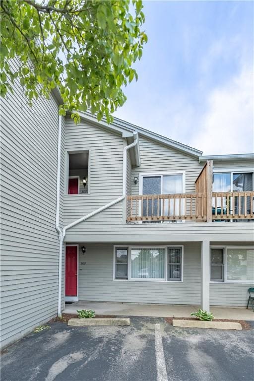 10 E St Unit 207, Cranston, RI 02920 - view of front of home with a balcony and uncovered parking