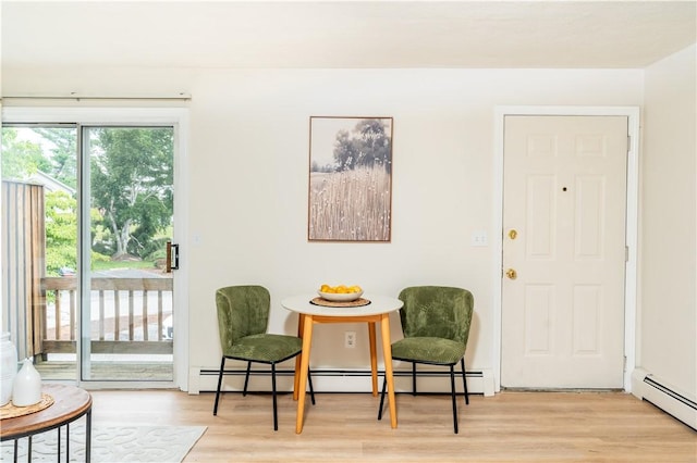 10 E St Unit 207, Cranston, RI 02920 - sitting room featuring a baseboard heating unit, a baseboard radiator, and wood finished floors