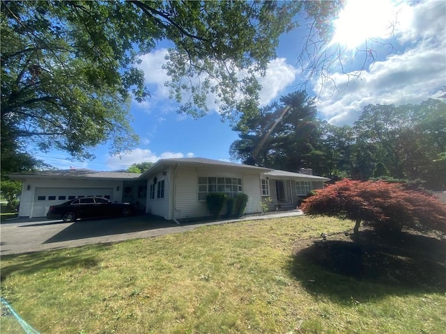109 Cobble Hill Rd, Lincoln, RI 02865 - ranch-style house with an attached garage, driveway, and a front lawn