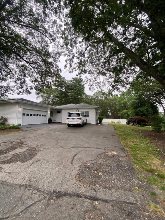 109 Cobble Hill Rd, Lincoln, RI 02865 - view of front of home with a garage and driveway