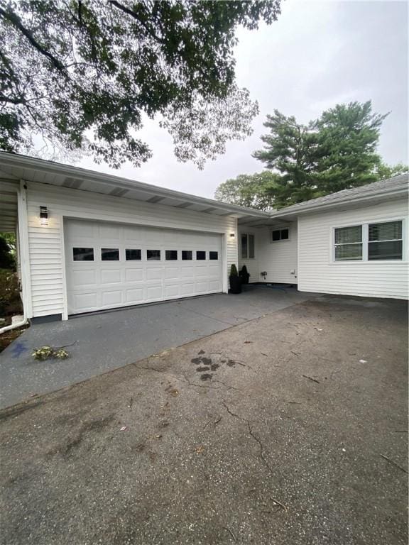 109 Cobble Hill Rd, Lincoln, RI 02865 - view of front of house featuring asphalt driveway and an attached garage
