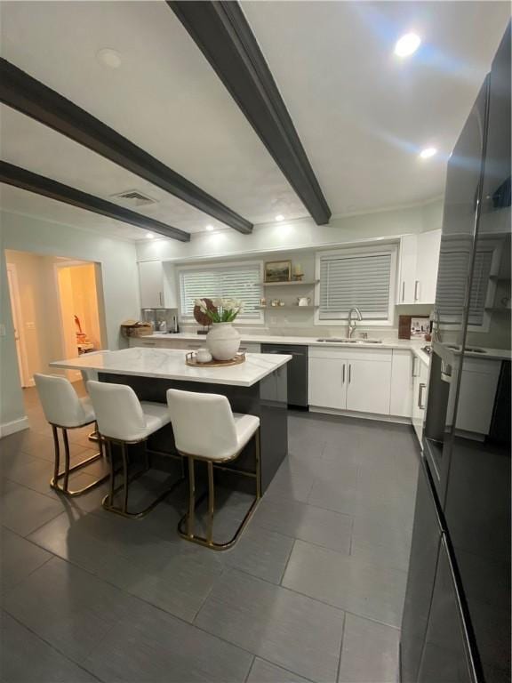 109 Cobble Hill Rd, Lincoln, RI 02865 - kitchen featuring dishwasher, a kitchen breakfast bar, light countertops, and beam ceiling