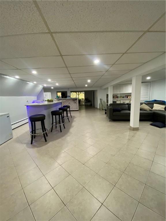 109 Cobble Hill Rd, Lincoln, RI 02865 - dining area with a baseboard heating unit, a drop ceiling, recessed lighting, and bar area
