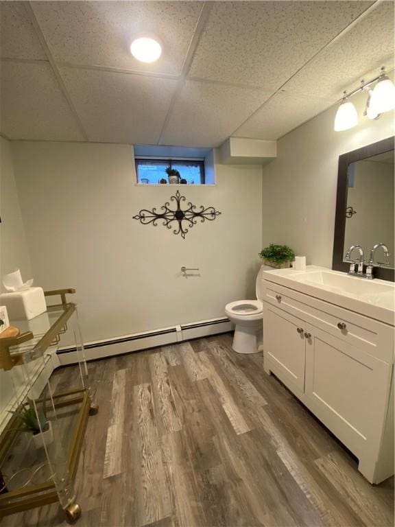 109 Cobble Hill Rd, Lincoln, RI 02865 - bathroom featuring vanity, wood finished floors, and a baseboard radiator