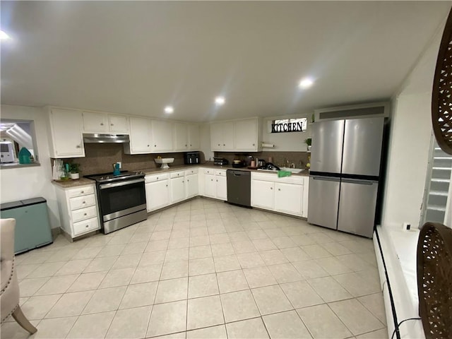 109 Cobble Hill Rd, Lincoln, RI 02865 - kitchen with appliances with stainless steel finishes, under cabinet range hood, white cabinetry, light tile patterned floors, and recessed lighting