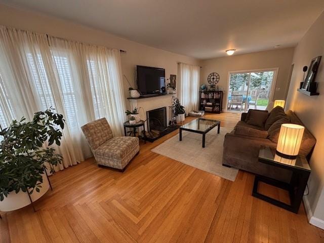 75 Lauriston St, Providence, RI 02906 - living room with a fireplace with raised hearth