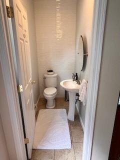 75 Lauriston St, Providence, RI 02906 - bathroom with toilet and tile patterned flooring
