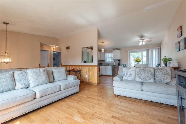 14 Gateway Ct, Warwick, RI 02889 - living area with light wood-style floors, a ceiling fan, wainscoting, and a chandelier
