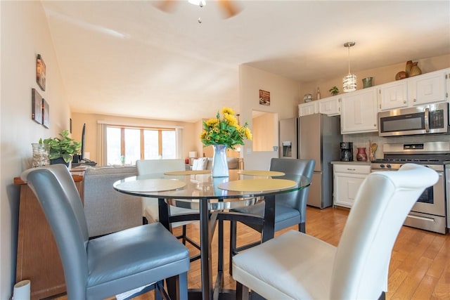 14 Gateway Ct, Warwick, RI 02889 - dining area with ceiling fan and light wood-style floors