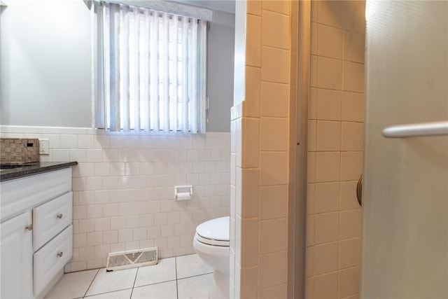 14 Gateway Ct, Warwick, RI 02889 - full bathroom with tile walls, tile patterned floors, vanity, and a shower stall