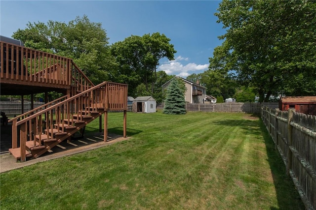 14 Gateway Ct, Warwick, RI 02889 - fenced backyard with a shed, stairway, and a wooden deck
