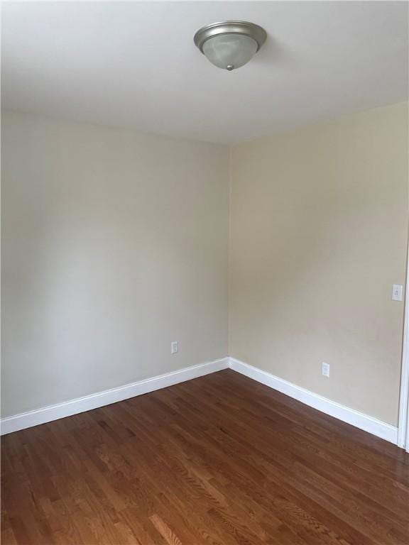 6 Larkspur Rd, Warwick, RI 02886 - empty room with dark wood-style floors