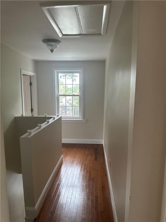 6 Larkspur Rd, Warwick, RI 02886 - corridor with attic access, dark wood finished floors, and an upstairs landing