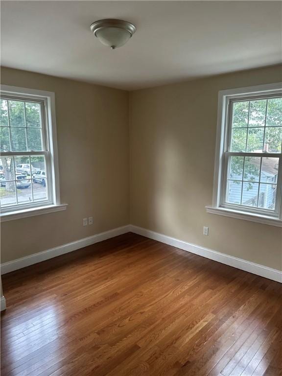 6 Larkspur Rd, Warwick, RI 02886 - unfurnished room with plenty of natural light and dark wood-style floors