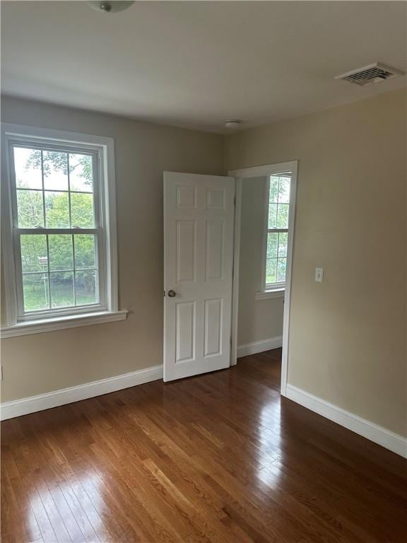 6 Larkspur Rd, Warwick, RI 02886 - empty room with healthy amount of natural light and wood finished floors