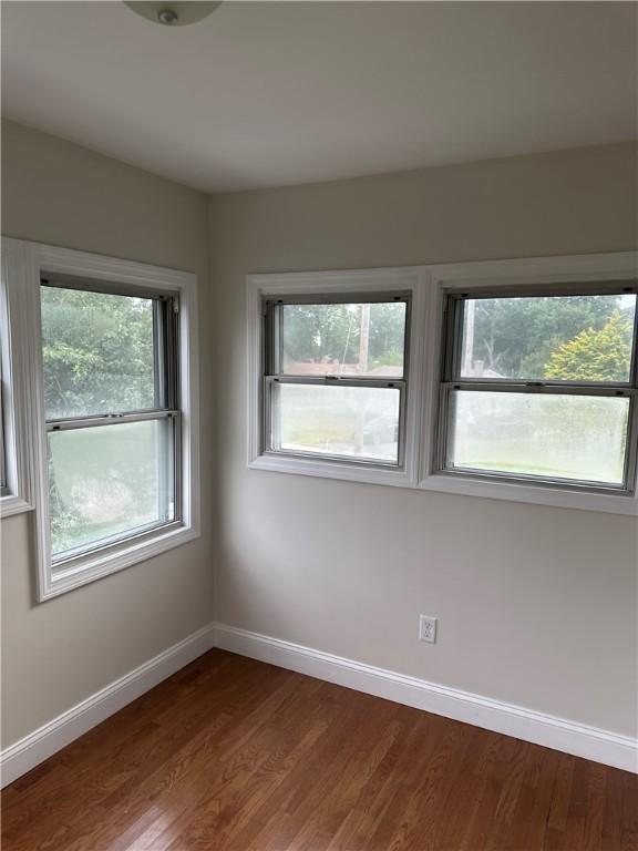 6 Larkspur Rd, Warwick, RI 02886 - unfurnished room with baseboards and dark wood-style floors