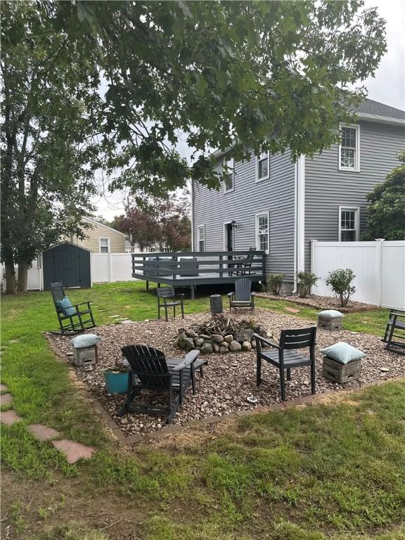 6 Larkspur Rd, Warwick, RI 02886 - view of yard featuring a storage unit, an outdoor fire pit, and a wooden deck
