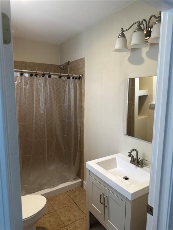 6 Larkspur Rd, Warwick, RI 02886 - full bathroom with vanity, tile patterned floors, and a shower stall