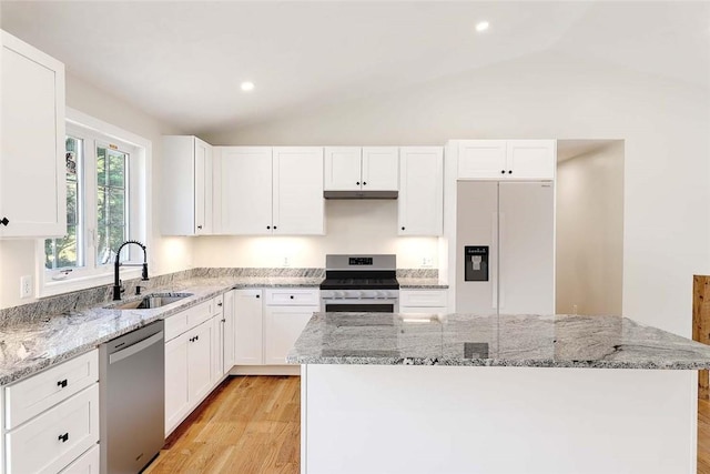 25 Walling Rd, Burrillville, RI 02830 - kitchen featuring appliances with stainless steel finishes, vaulted ceiling, light wood finished floors, white cabinets, and recessed lighting