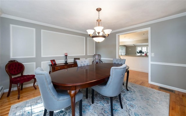 2 Elizabeth Ann Dr, Johnston, RI 02919 - dining room featuring a chandelier, ornamental molding, and wood finished floors