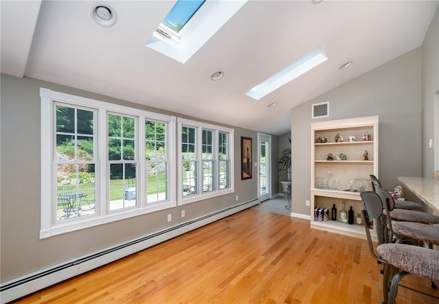 2 Elizabeth Ann Dr, Johnston, RI 02919 - office space featuring a baseboard radiator, a skylight, lofted ceiling, plenty of natural light, and wood finished floors