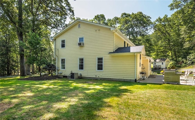 2 Elizabeth Ann Dr, Johnston, RI 02919 - rear view of house with a patio area, a yard, and cooling unit