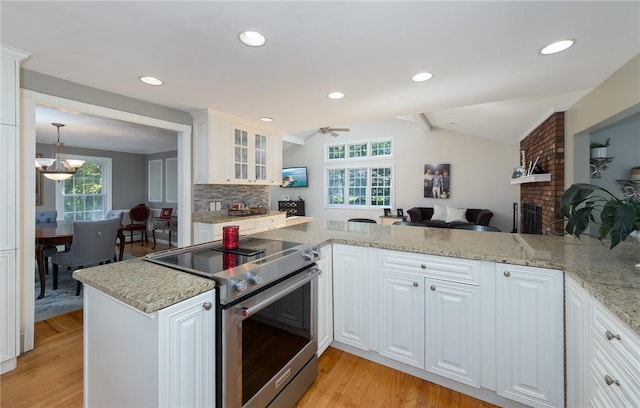 2 Elizabeth Ann Dr, Johnston, RI 02919 - kitchen with electric range, ceiling fan, a fireplace, light wood finished floors, and glass insert cabinets