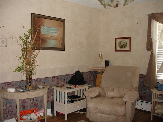 115 Slater Park Ave, Pawtucket, RI 02861 - sitting room with a baseboard heating unit and wood finished floors