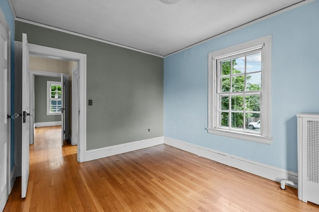 189 Butler Ave, Providence, RI 02906 - spare room featuring crown molding and wood finished floors