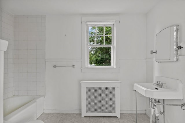 189 Butler Ave, Providence, RI 02906 - full bath featuring radiator, tub / shower combination, and tile patterned flooring