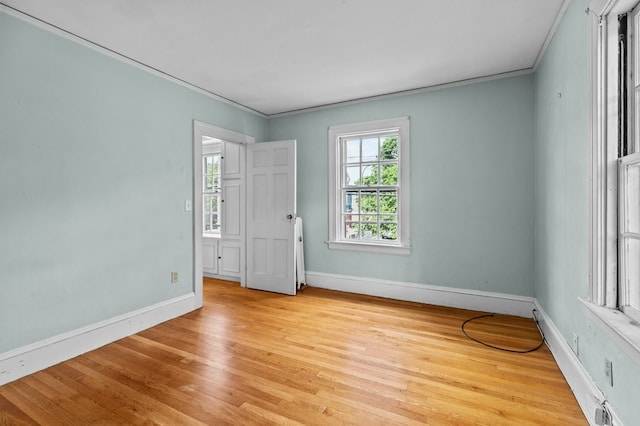189 Butler Ave, Providence, RI 02906 - spare room featuring light wood-style floors and ornamental molding