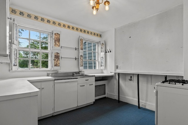 189 Butler Ave, Providence, RI 02906 - kitchen featuring dark floors, white appliances, light countertops, and white cabinets