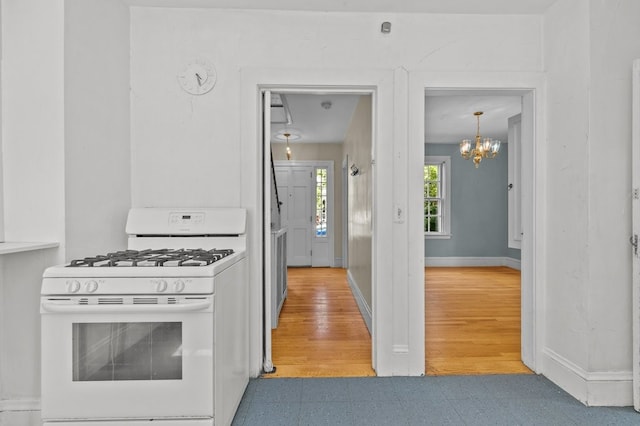 189 Butler Ave, Providence, RI 02906 - kitchen with white gas range oven and a chandelier