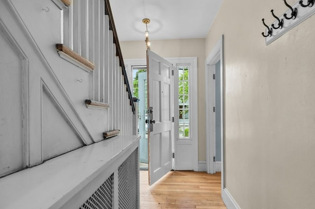 189 Butler Ave, Providence, RI 02906 - entryway with light wood-style flooring and stairs