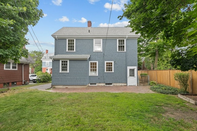 189 Butler Ave, Providence, RI 02906 - back of property with a chimney and a shingled roof