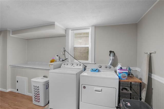 12 Elmore Ave, North Providence, RI 02911 - laundry area with separate washer and dryer, a textured ceiling, and light wood-type flooring