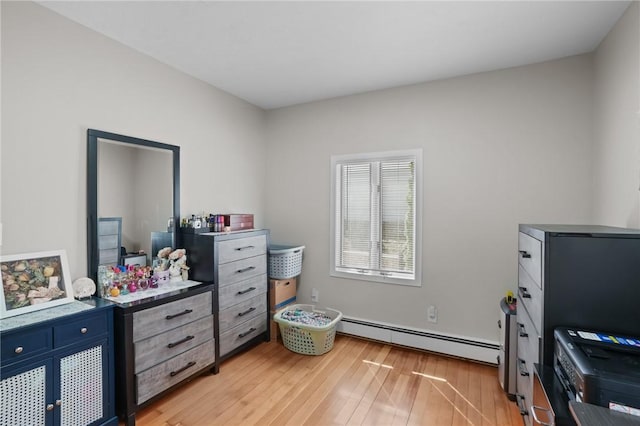 12 Elmore Ave, North Providence, RI 02911 - bedroom featuring baseboard heating and light wood-type flooring