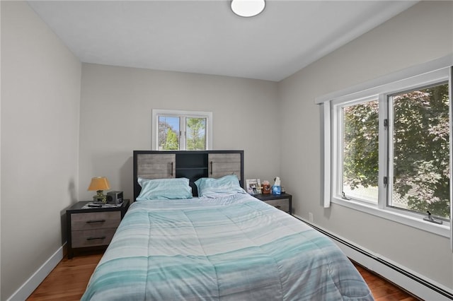12 Elmore Ave, North Providence, RI 02911 - bedroom featuring baseboard heating and wood finished floors