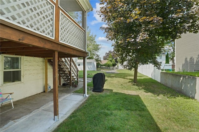 12 Elmore Ave, North Providence, RI 02911 - view of green lawn with stairs, a patio, and a wooden deck
